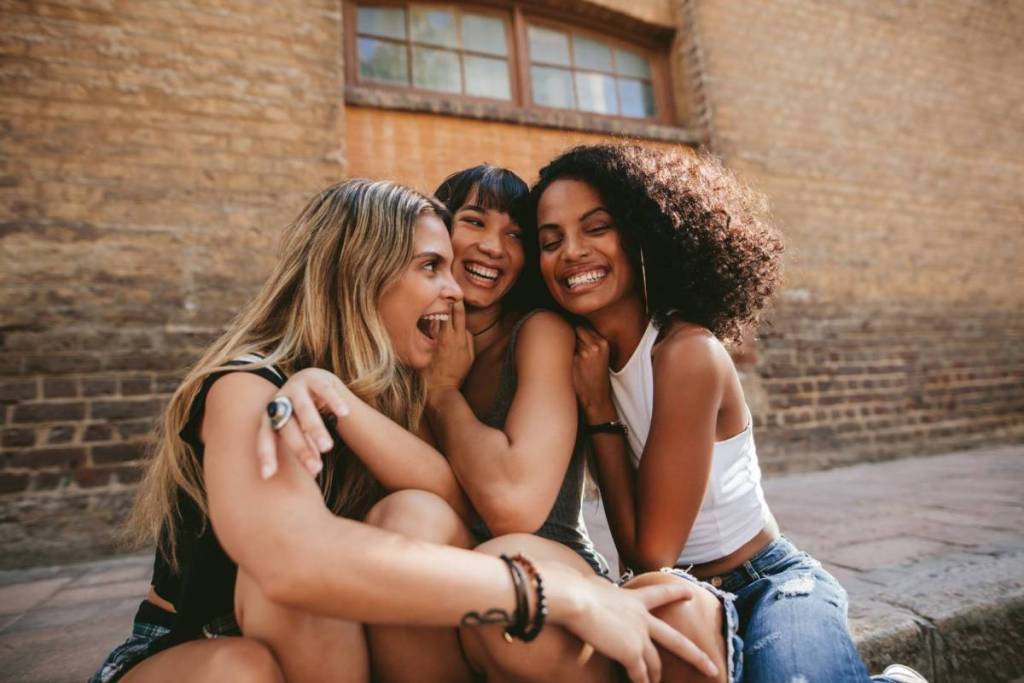 A group of three women laughing