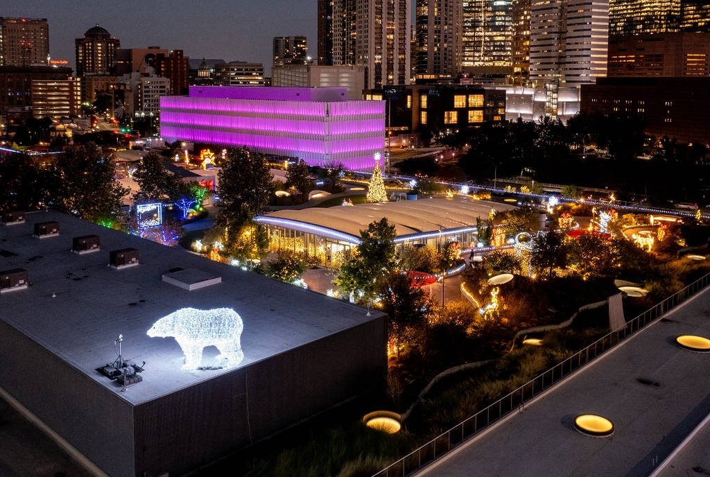 Image shows the rooftop at POST Houston lit up in holiday decorations.
