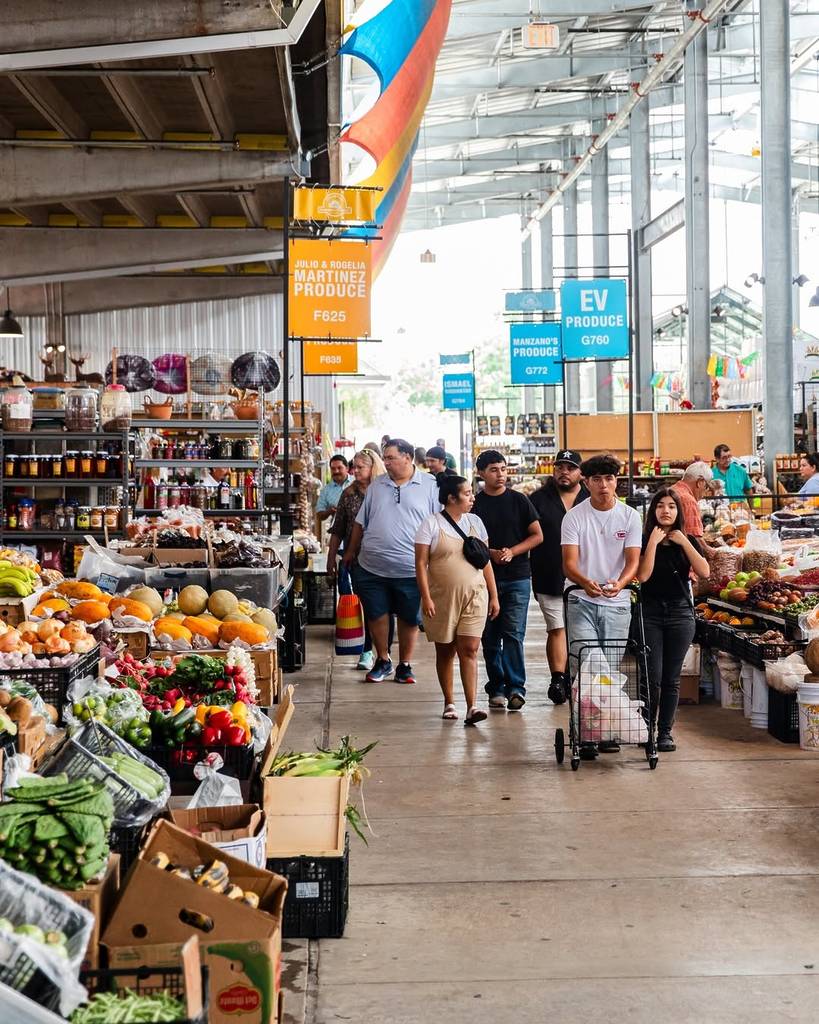 Image shows people strolling around Houston Farmers Market.
