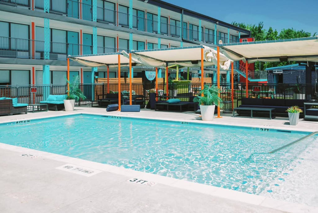 Image shows the pool at Heights House Hotel and the new Soluna poolside bar.