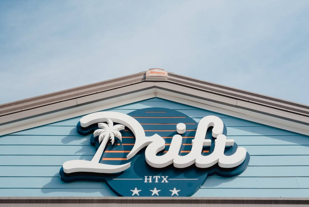 Image shows the signage of Drift Bar in Houston