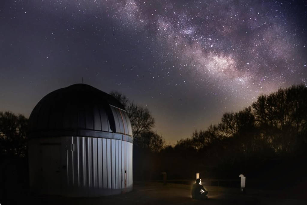 Image shows the George Observatory against the backdrop of the Milky Way.