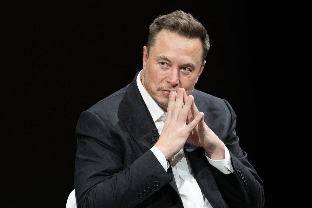 Image shows Elon Musk at an event