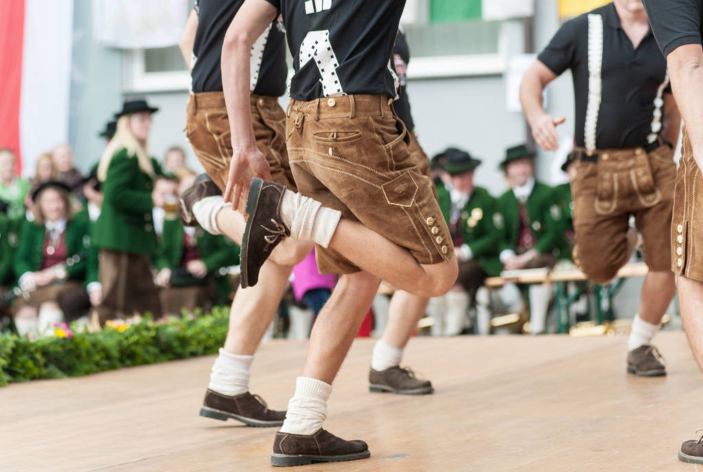 Image shows a group dancing during an Oktoberfest celebration