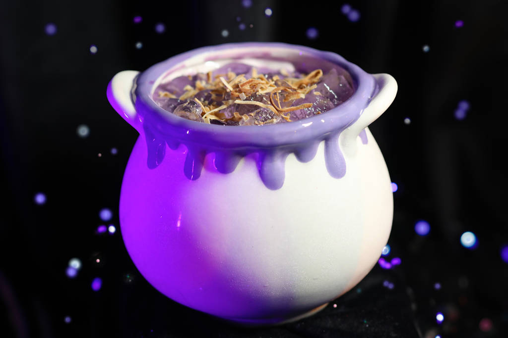 Image shows a cocktail at the Cursed Cauldron pop-up in Houston presented in a bowl-shaped glass.