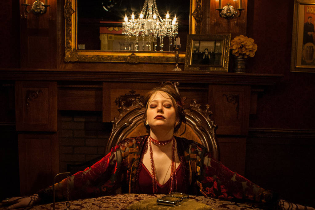 Image shows the Madame Daphne character at 