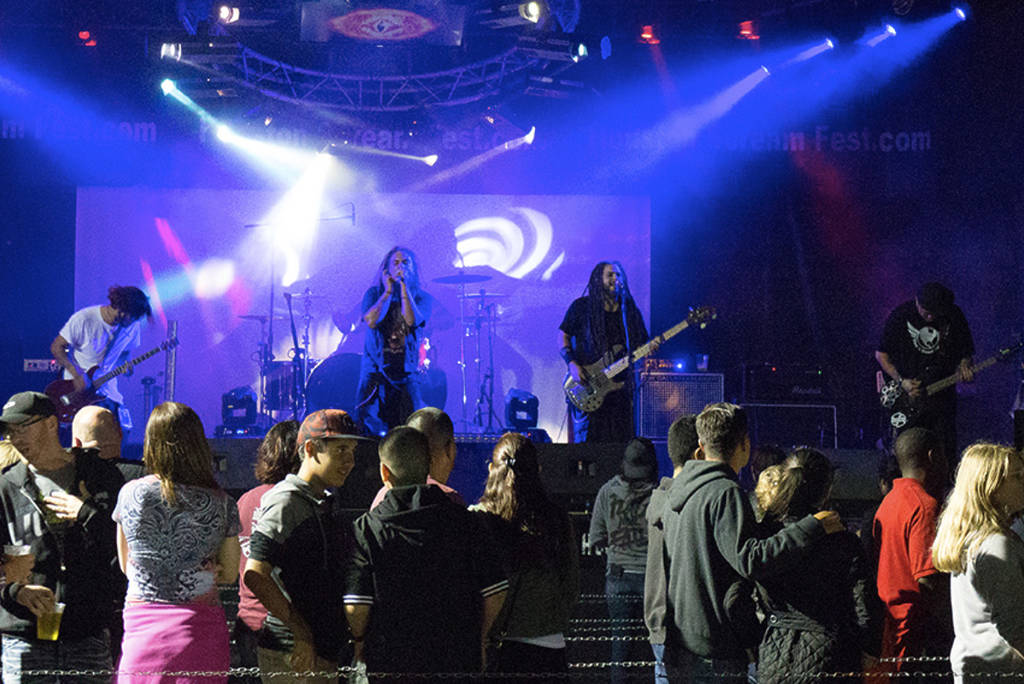 Image shows a band performing on stage at Houston Scream Fest