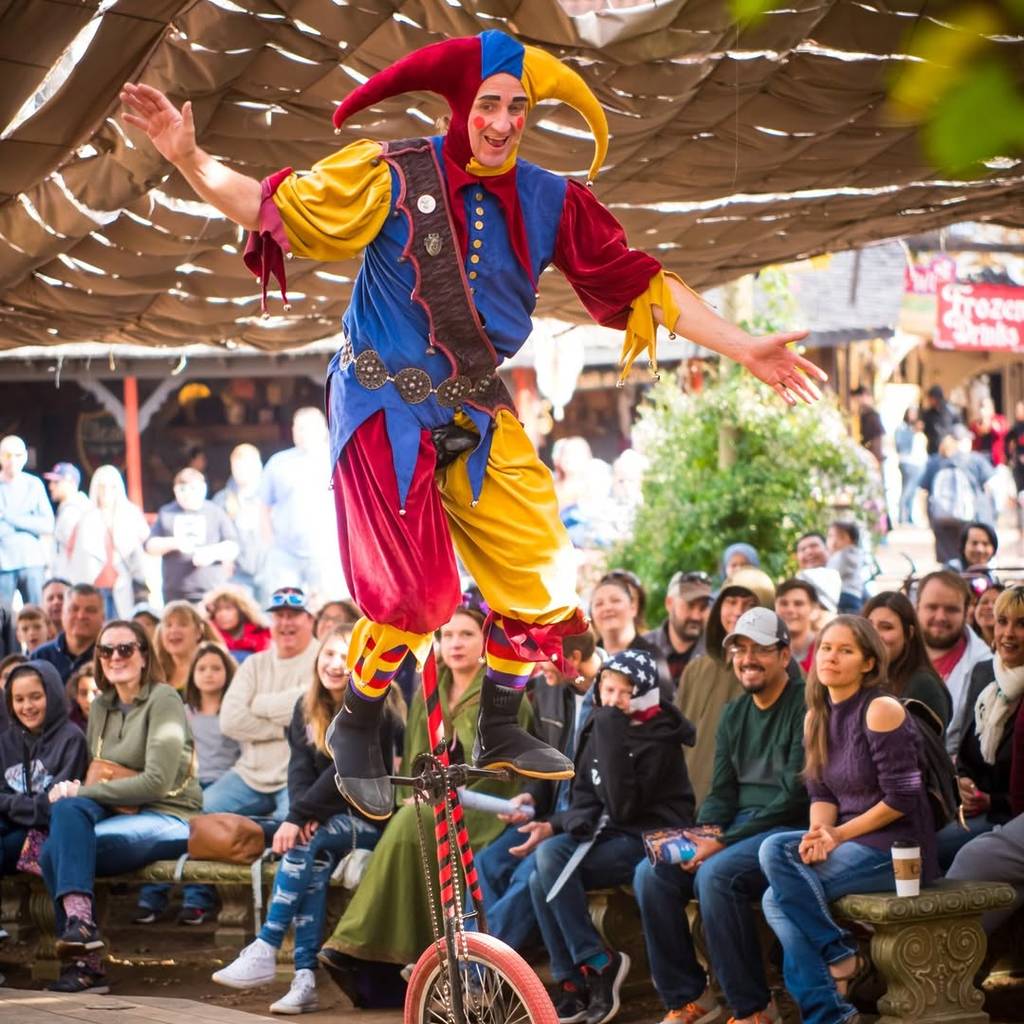 Image shows a clown show at the Texas Renaissance Festival just outside Houston.