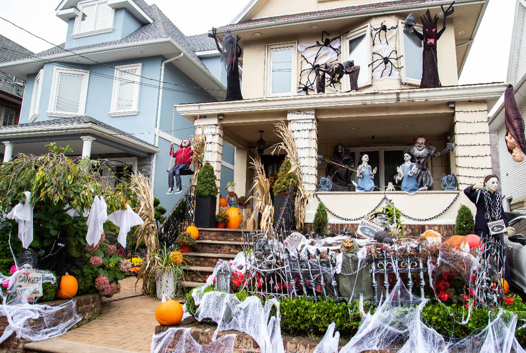 Image shows a house adorned in Halloween decorations.