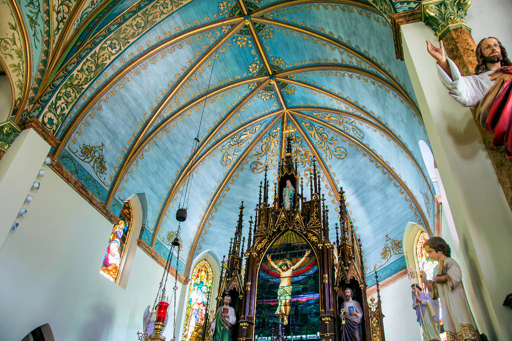 Image shows the intricate ceiling of the St. Mary Catholic Church painted church in Schulenberg, Texas.
