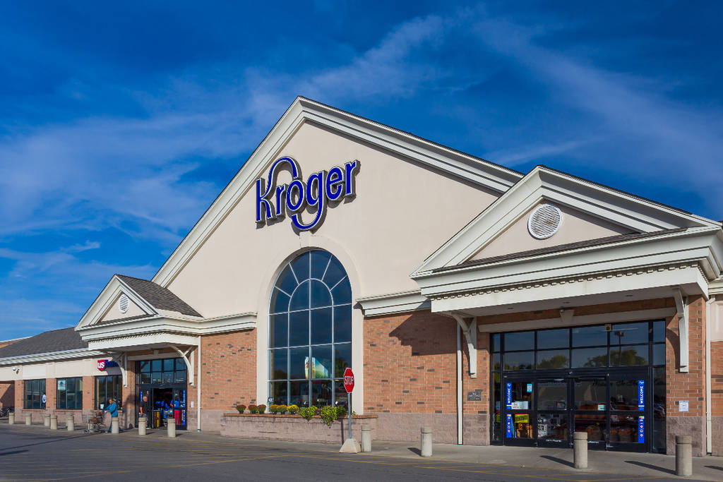 Image shows the outside of a Kroger during daytime.