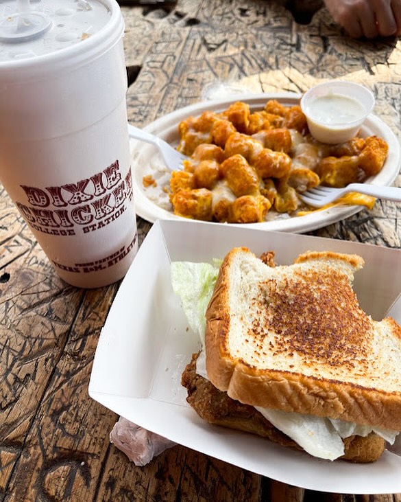 Image shows a sandwich and fries dish at Dixie Chicken.