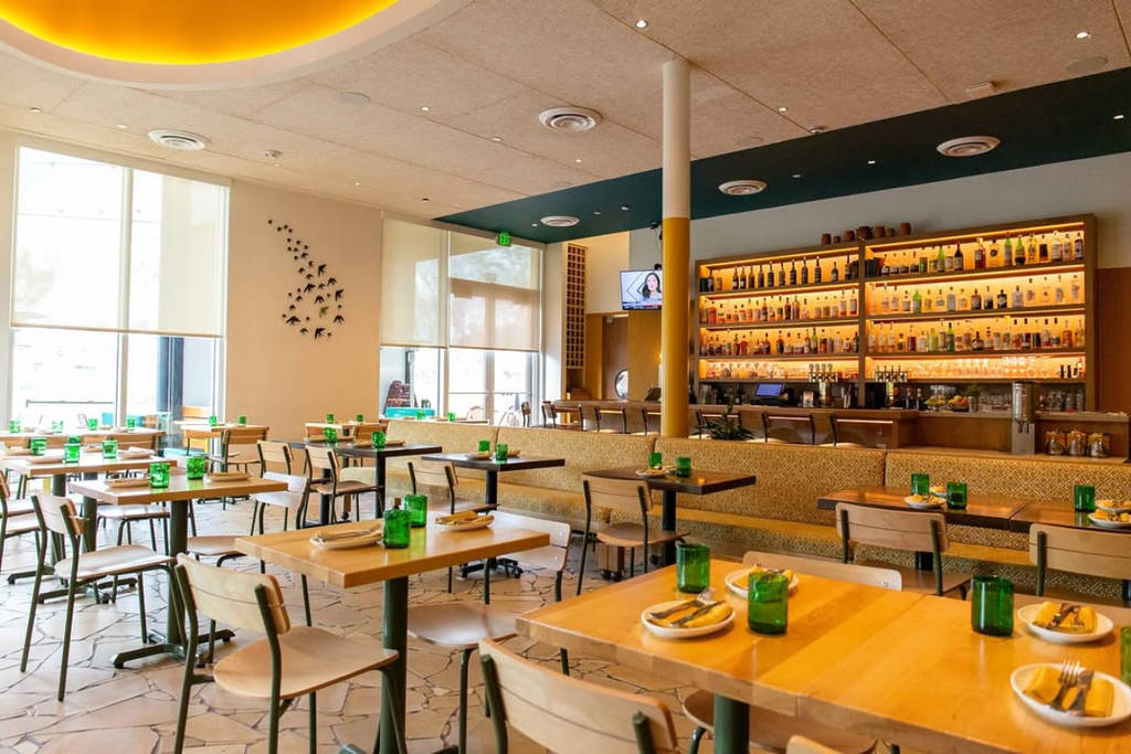 Image shows the interior of de Gama restaurant in Houston, featuring the bar in the background.