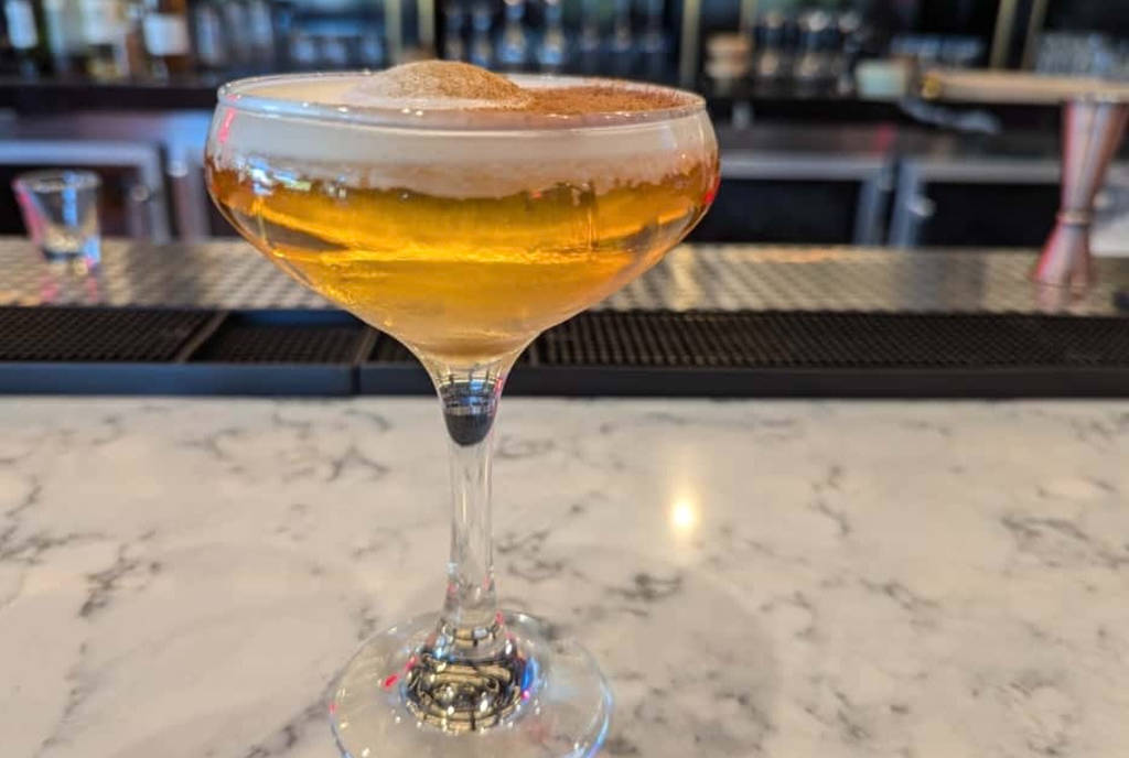 Image shows the Trick or Treat cocktail at Kazzan Ramen & Bar in Houston.