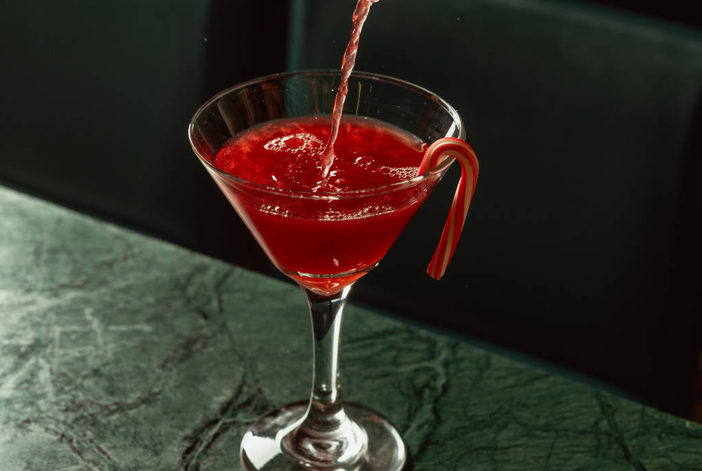 Image shows the Santa Clausmopolitan drink at the Havana Holiday pop-up in Houston