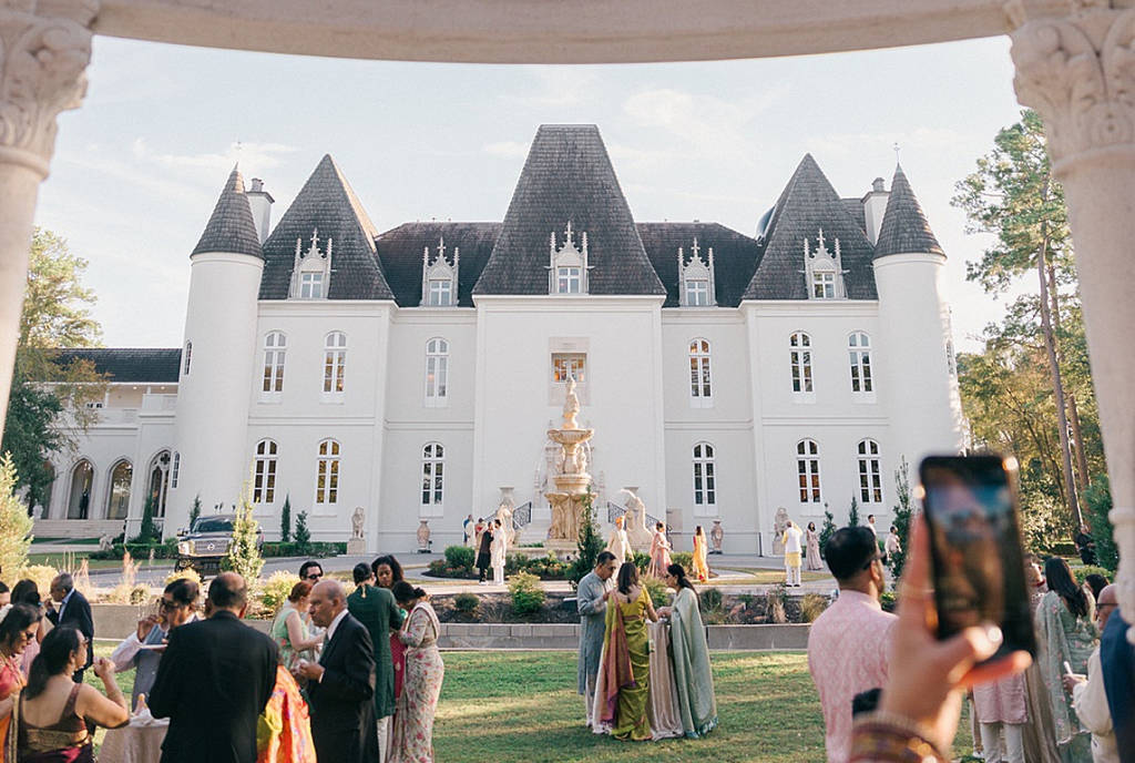Image shows a wedding party at a ceremony at Chateau Nouvelle in Houston