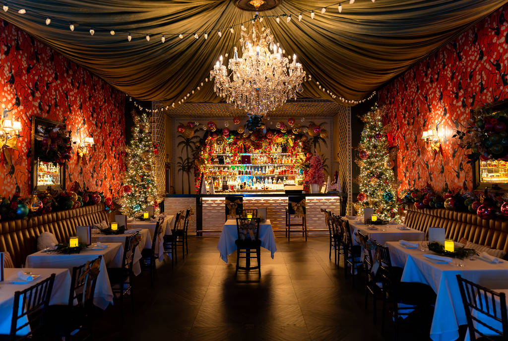 Image shows the interior of Emilia's Havana decorated in holiday decor.