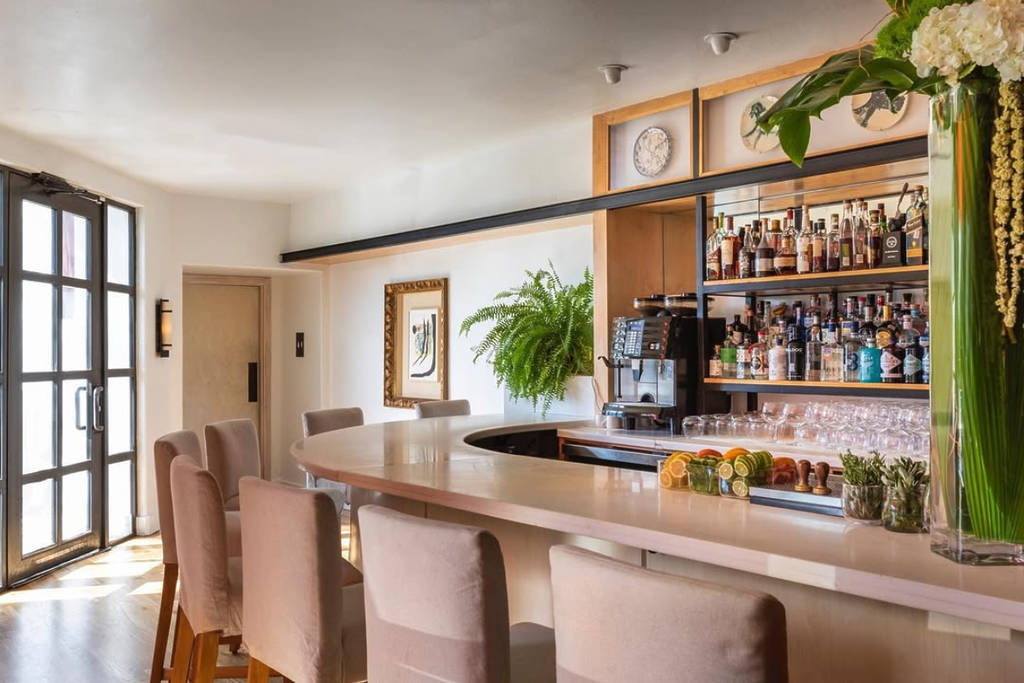 Image shows the interior and bar of BCN Taste & Tradition in Houston, Texas.