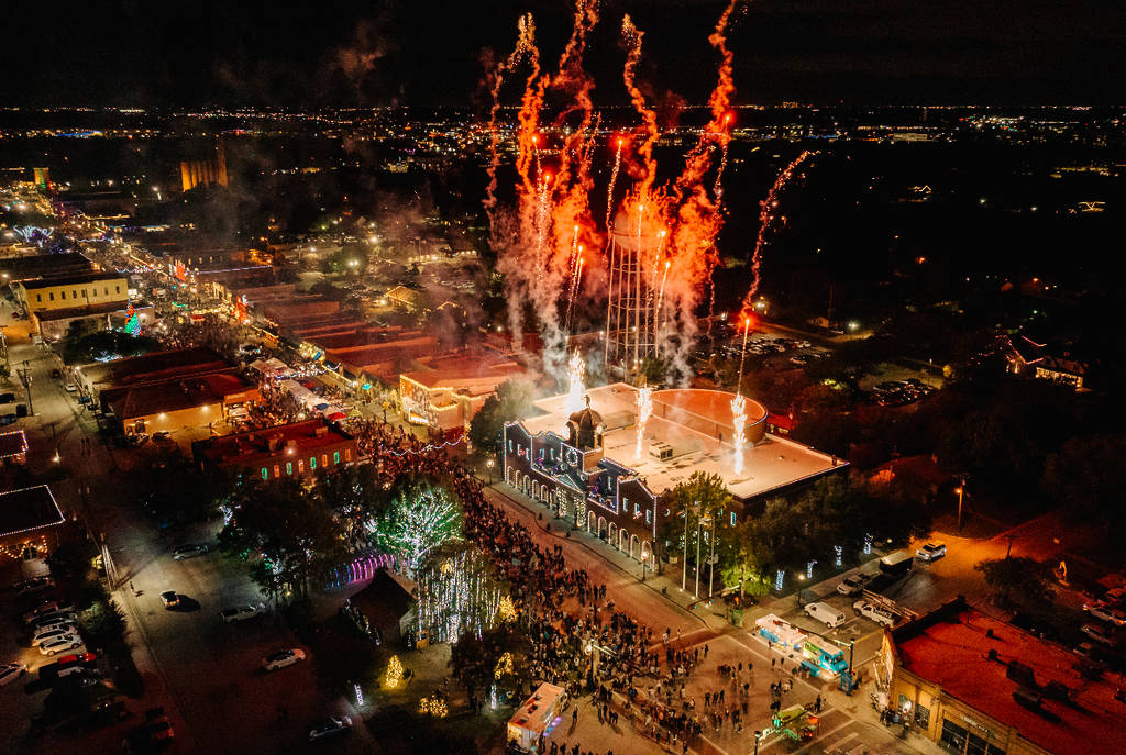 Image shows an aerial view of a holiday celebration occurring in Grapevine, Texas.