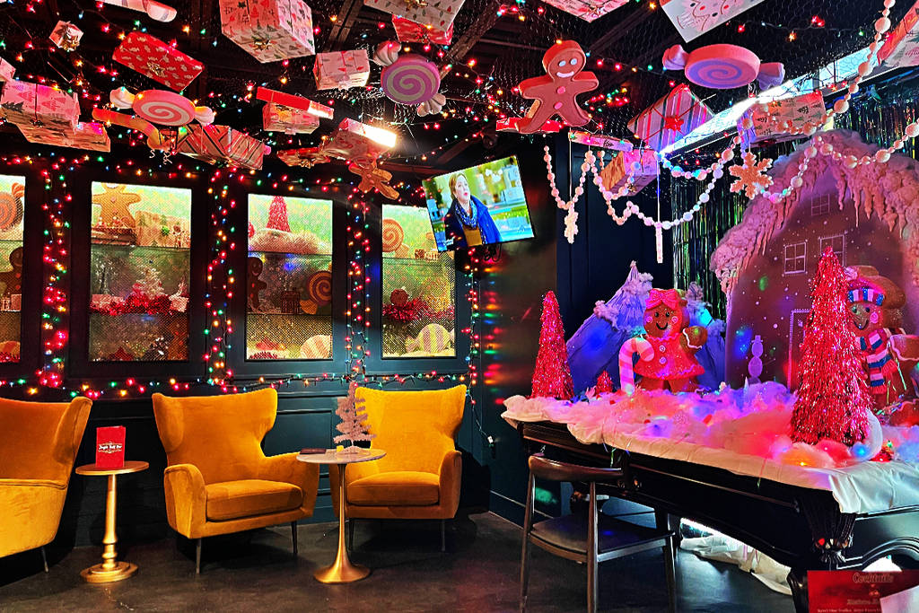 Image shows the Candy Cane Lane room of the JIngle Bell Bar pop-up in Houston.