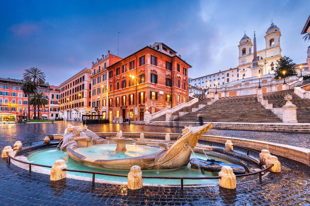 Image shows a fountain and building in Rome, Italy.
