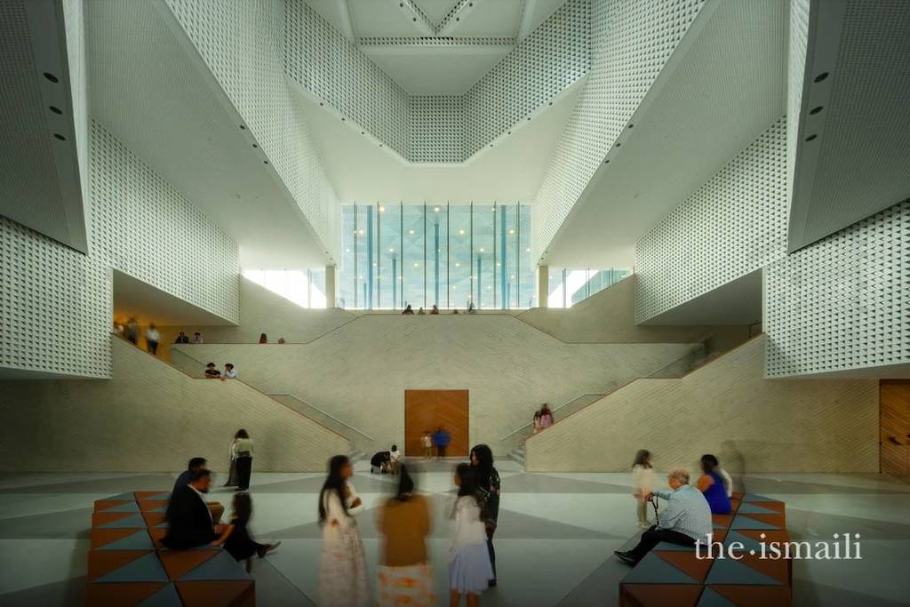 Image shows the main atrium of the Ismaili Center in Houston with visiting people.