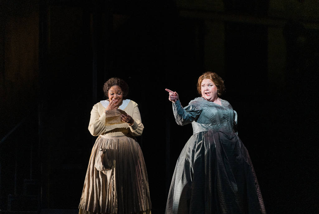 Image shows Janai Brugger and Jamie Barton on stage in Civil War era costumes performing for the Houston Grand Orchestra production of "Intelligence".