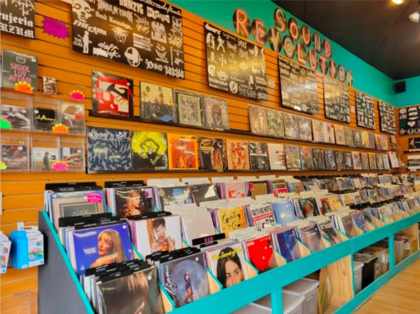 Image shows shelves of records featured at Sound Revolution in Houston.