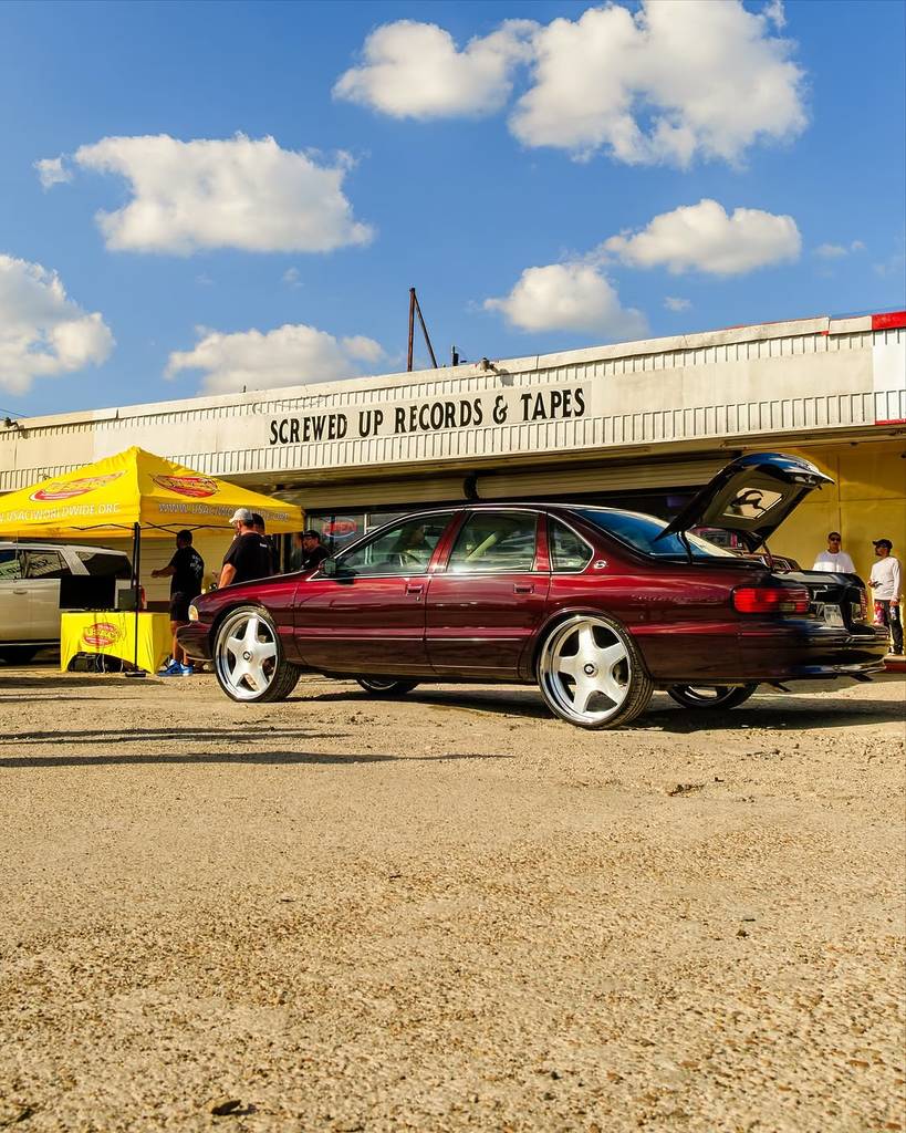 Image shows a SLAB vehicle parked in front of Screwed Up Records & Tapes