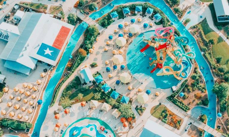Image shows an overhead shot of Typhoon Texas waterpark with slides, pools, and more.