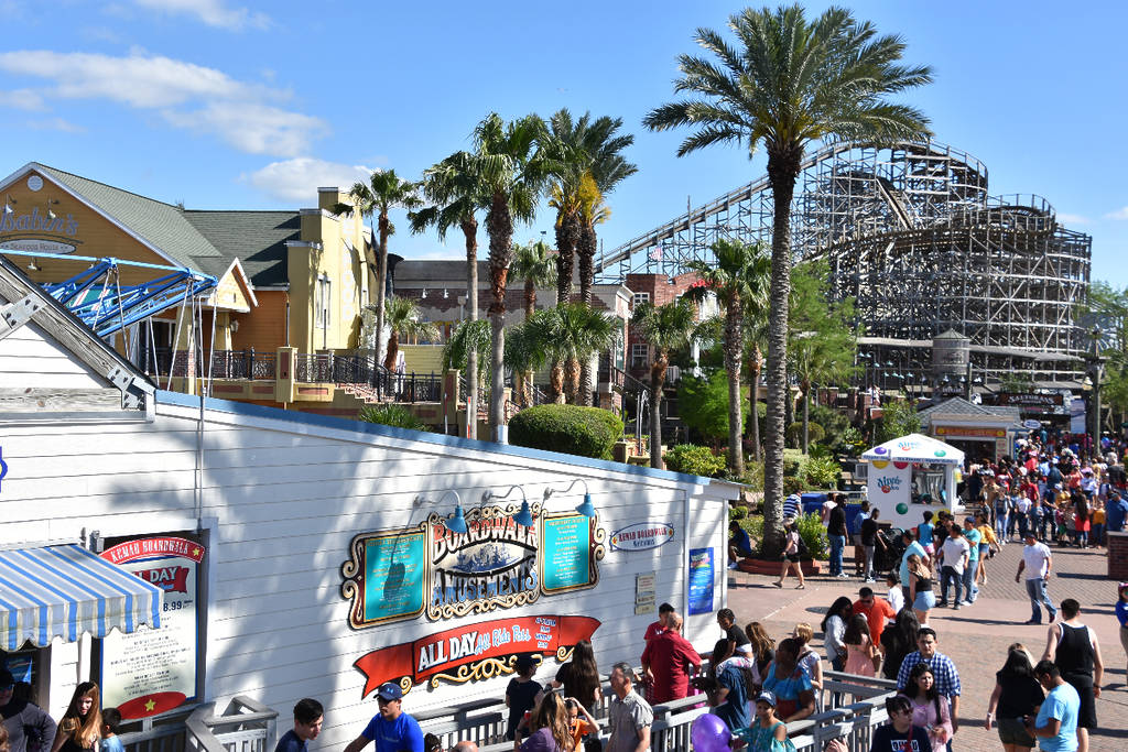 Image shows attractions at the Kemah Boardwalk in Galveston, Texas.