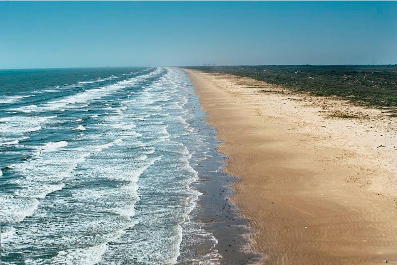 Image shows the coastline at Port Aransas, Texas.
