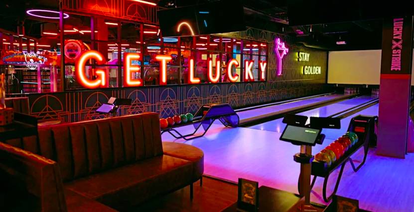 Image shows interior of Lucky Strike bowling alley. 