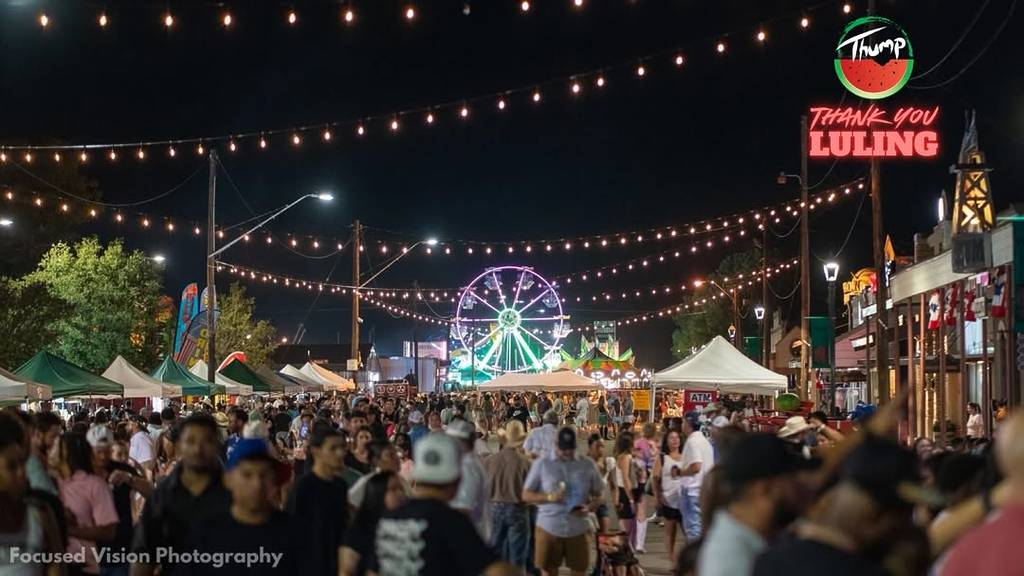 Image shows the carnival grounds of the Watermelon Thump festival in Luling, Texas at night. 