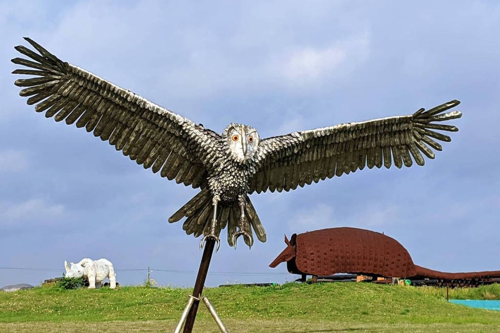 Image shows an owl sculpture at the Eclectic Menagerie Park in Houston, Texas.