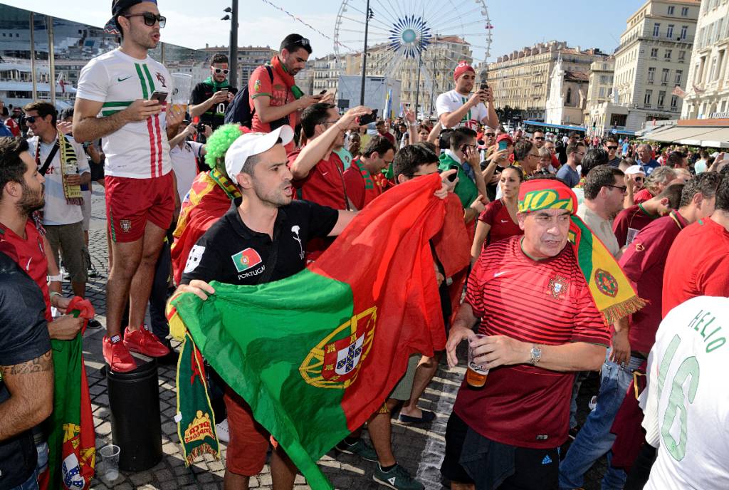 Image shows Portugal fans as part of a soccer fan event.
