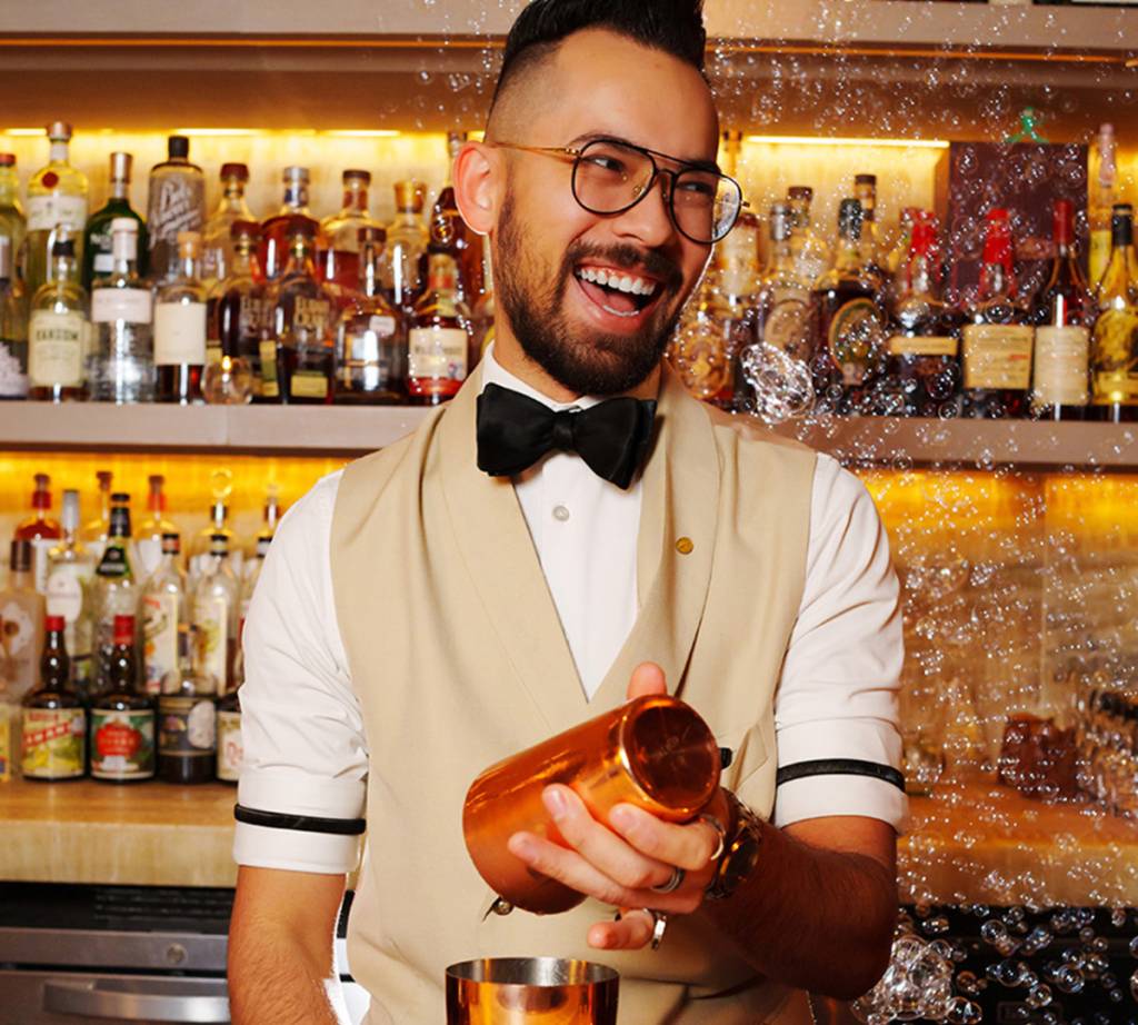Image shows a bartender at Bandista speakeasy in Houston. 