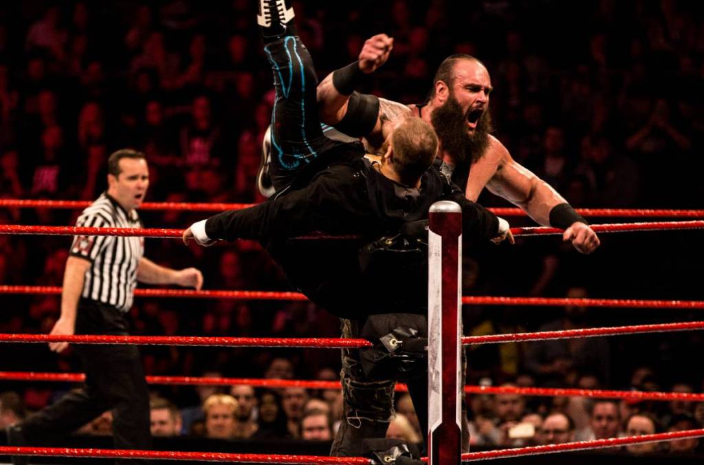 Image shows two wrestlers in a bout for a WWE event.