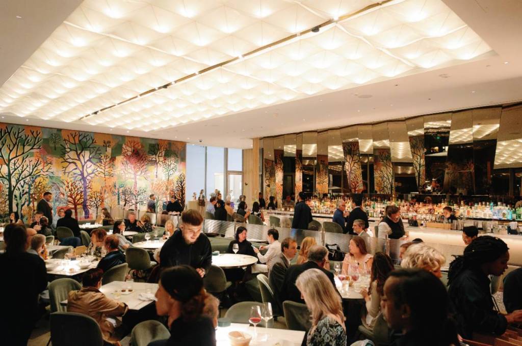 Image shows patrons dining at Le Jardinier in Houston. 