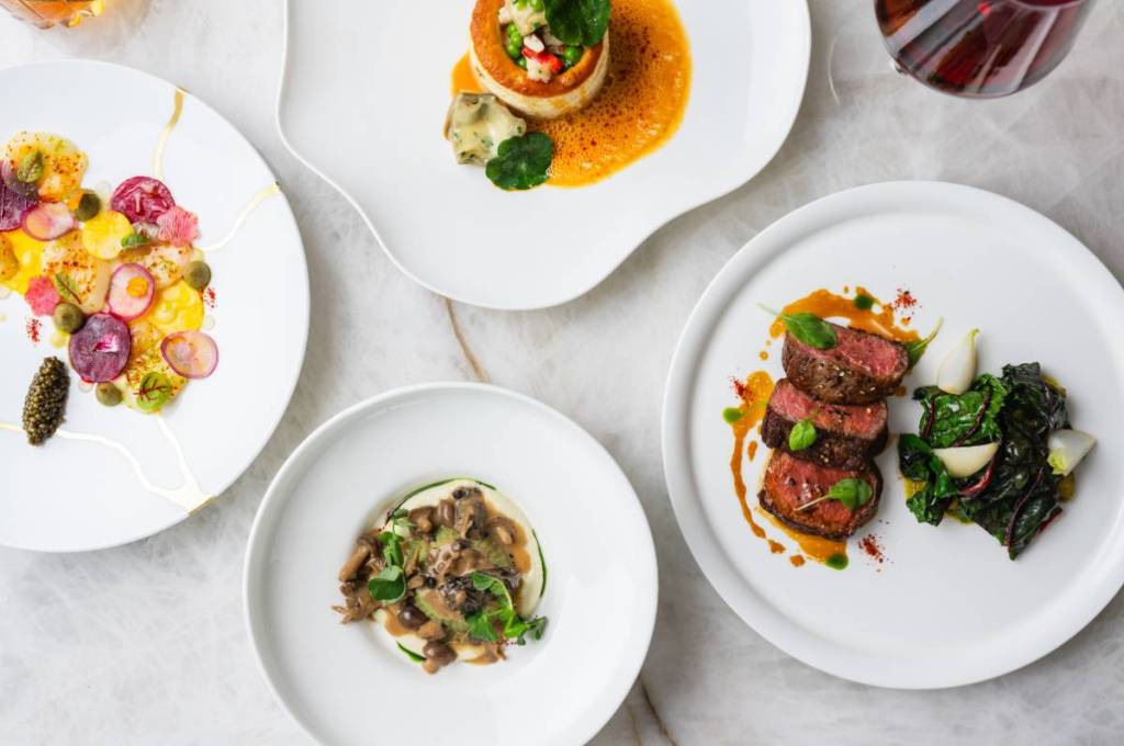 Image shows plates served at Le Jardinier during Houston Restaurant Weeks. 