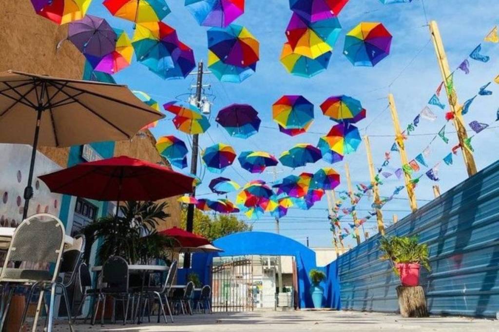 Image shows an umbrella installation in Old Town Harrisburg, Houston.