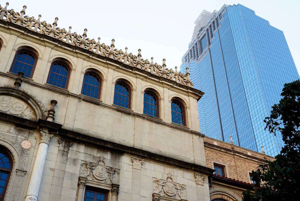 Image shows the Julia Ideson Building with another Houston building in the background. 