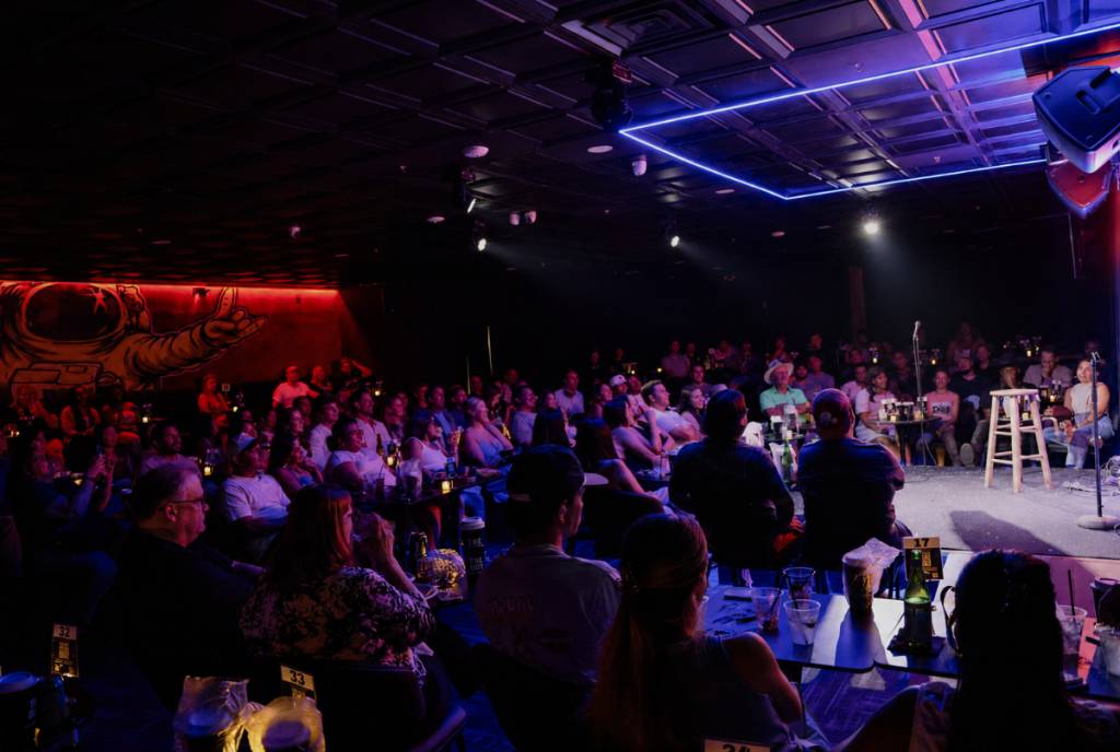 Image shows the performance stage and space at Riot Comedy Club.