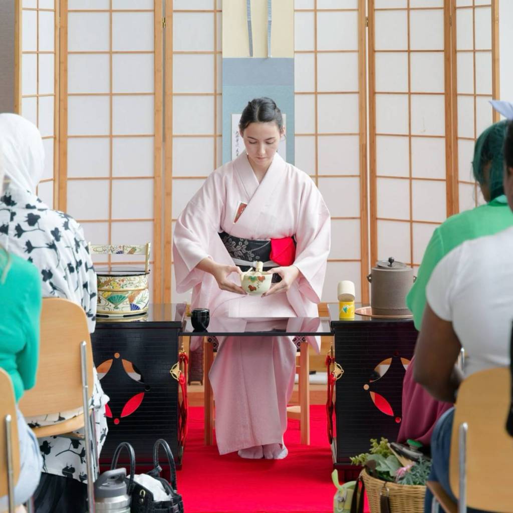 Image shows a traditional tea ceremony at Japan Festival Houston.