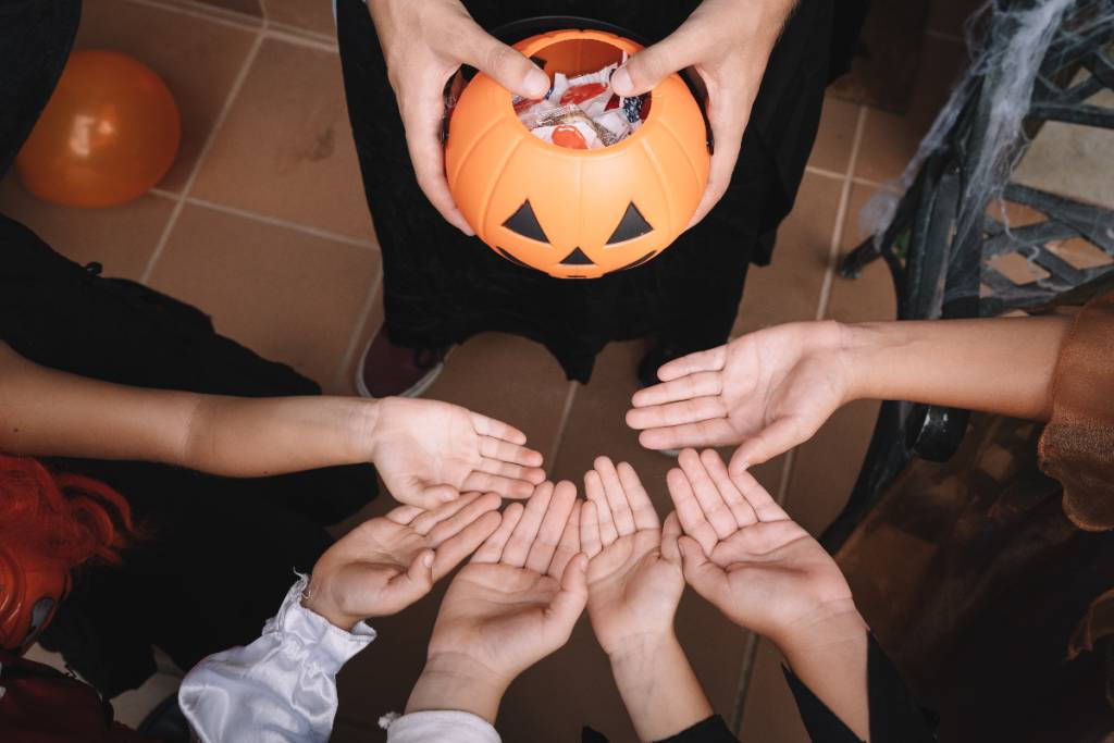 Image shows trick-or-treaters.