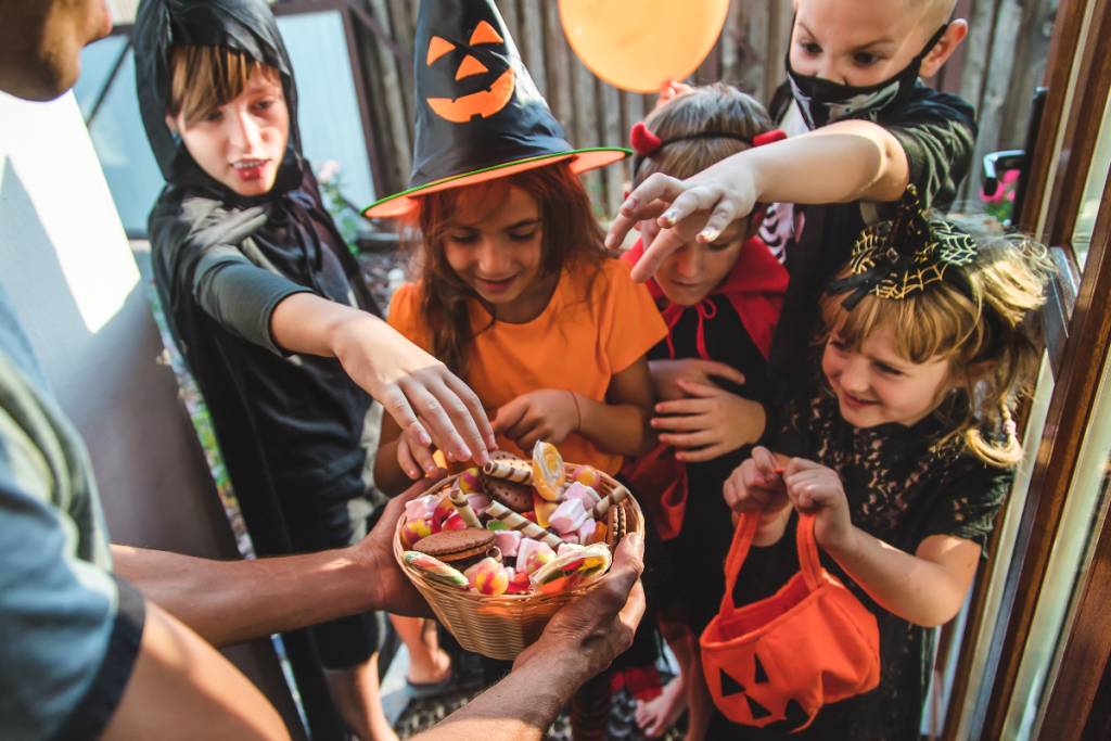 Image shows trick-or-treaters.