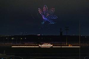 Drones light up the sky over a string quartet