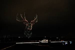 Drones light up the sky over a string quartet