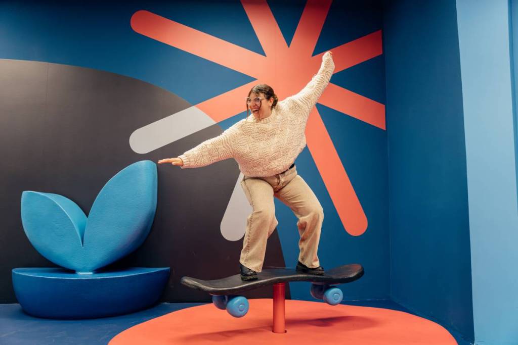visitor experiencing IKONO exhibition on a skateboard