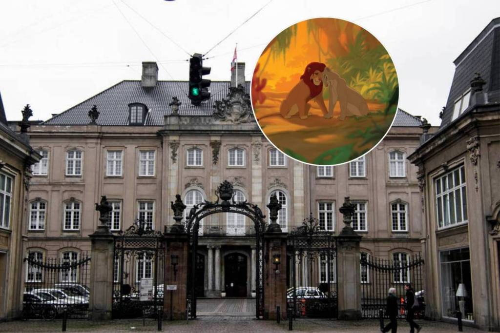 The grand exterior of Odd Fellow Palæet in Copenhagen featuring a still of Nala and Simba from The Lion King in the jungle